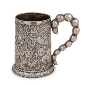 An antique Chinese export silver tankard with repousse&nbsp;decoration of stylised cranes&nbsp;and grasshoppers among&nbsp;lily foliage. The handle of beaded scorpion&nbsp;tail form. Engraved&nbsp;ownership&nbsp;monogram&nbsp;within a shield cartouche and&nbsp;secondary initials to the base. Th