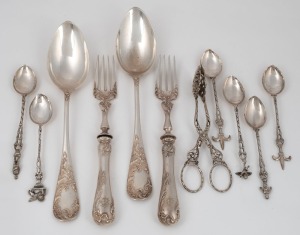 A selection of European 800 silver flatware including two German&nbsp;table forks and serving spoons with floral decoration, a pair of sugar tongs and six mixed twist handle teaspoons with figurative finials. 19th and 20th century, (11 items), the German servi