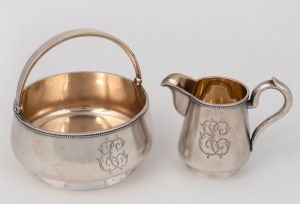 An antique Russian silver sugar bowl and milk jug with bead decoration and engraved monogram. Kokoshnik mark for Anton Vasilijevitch Richter, Astrakhan, circa 1900, (2 items), the milk jug 9cm high, 356 grams total.