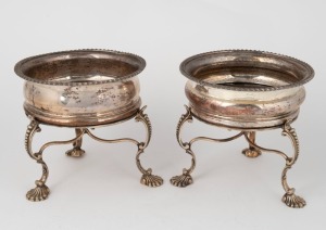 A pair of antique English Sheffield plate wine bottle coasters on shell footed stands, 19th century, 14cm high