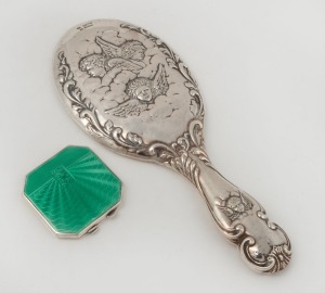 An antique sterling silver "Chorus of Angels" hand mirror, together with an attractive Art Deco silver and green enamel powder compact, (2 items), ​​​​​​​the mirror 27cm high