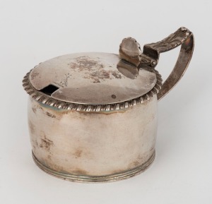 A Georgian sterling silver mustard pot with original blue glass liner, made by Rebecca Emes & Edward Barnard of London, circa 1781, 6cm high, 10.5cm wide, 116 grams not including liner