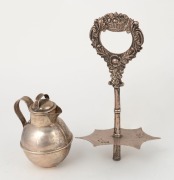 An antique English sterling silver Jersey cream jug with Jersey retailer's stamp, made by W.G. Souther of Birmingham, circa 1898; together with a Georgian sterling silver cruet handle (as is), made in London, circa 1825, (2 items), the jug9cm high, 174 gr