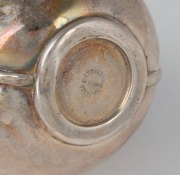 An antique English sterling silver Jersey cream jug with Jersey retailer's stamp, made by W.G. Souther of Birmingham, circa 1898; together with a Georgian sterling silver cruet handle (as is), made in London, circa 1825, (2 items), the jug9cm high, 174 gr - 2