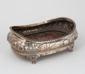 A Georgian sterling silver coaster with floral decoration and wooden base, made in London, circa 1825, 8cm high, 20cm wide, 326 grams including wooden base