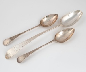 An 18th century sterling silver basting spoon with engraved feathered edge decoration (marks rubbed); together with a pair of Georgian sterling silver tablespoons with fine engraved decoration by Richard Ferris of Exeter, circa 1796, (3 items), the bastin