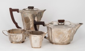 An English Art Deco sterling silver tea set comprising of teapot, hot water pot, two handled sugar bowl and milk jug. Each with engraved ownership monogram and original bakelite handles. Manufactured by Suckling Ltd. of Birmingham, circa 1941, (4 items), 