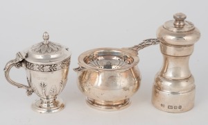 An antique English sterling silver mustard pot in the classical style with acanthus decoration, made in London, circa 1899; together with a sterling silver pepper mill marked B.&H. made in London, circa 1979; and a sterling silver tea strainer by R.P.&C. 