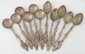 Eleven assorted Japanese Nagasaki spoons with cast dragons and engraved decoration, 20th century, stamped "Moji, '84" with maker's seal mark, 12cm and 13cm long, 190 grams.