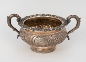 An antique sterling silver sugar basin, attractively decorated with floral chased motif, mid 19th century, 12cm high, 23cm wide, 416 grams