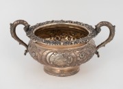 An antique sterling silver sugar basin, attractively decorated with floral chased motif, mid 19th century, 12cm high, 23cm wide, 416 grams