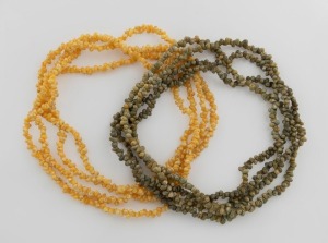 Two vintage shell bead necklaces in green and yellow, 20th century, each an impressive 170cm long