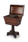An antique English William IV period sarcophagus form&nbsp;cellarette, handsomely&nbsp;veneered in rosewood with knurled moulding and brass carrying handles to the sides.&nbsp;The tapered pedestal&nbsp;terminating in a quadriform base with brass castors, circa 1840, 74cm hig - 2