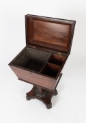 An antique English William IV period sarcophagus form&nbsp;cellarette, handsomely&nbsp;veneered in rosewood with knurled moulding and brass carrying handles to the sides.&nbsp;The tapered pedestal&nbsp;terminating in a quadriform base with brass castors, circa 1840, 74cm hig - 3