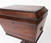 An antique English William IV period sarcophagus form&nbsp;cellarette, handsomely&nbsp;veneered in rosewood with knurled moulding and brass carrying handles to the sides.&nbsp;The tapered pedestal&nbsp;terminating in a quadriform base with brass castors, circa 1840, 74cm hig - 5