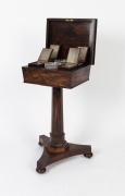 GILLOWS&nbsp;(attributed),&nbsp;fine quality antique English William IV rosewood veneered&nbsp;sarcophagus&nbsp;form teapoy with&nbsp;original&nbsp;fitted interior with four lidded caddys and two mixing bowls. Faceted tapering pedestal terminating&nbsp;in a triform base with bun feet and b - 2