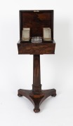GILLOWS&nbsp;(attributed),&nbsp;fine quality antique English William IV rosewood veneered&nbsp;sarcophagus&nbsp;form teapoy with&nbsp;original&nbsp;fitted interior with four lidded caddys and two mixing bowls. Faceted tapering pedestal terminating&nbsp;in a triform base with bun feet and b - 3