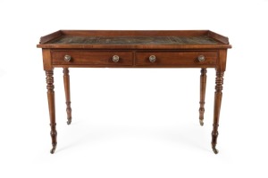 An antique English William IV mahogany writing table with two cock beaded drawers to the frieze&nbsp;supported on ring turned&nbsp;legs with brass castors and green tooled leather writing surface with gallery back, circa 1845, 82cm high, 122cm wide, 57cm deep.