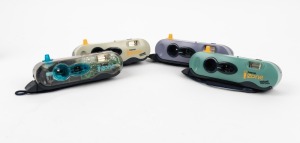 POLARIOD: Four c. 2000 I-Zone instant cameras - one transparent, one white, one purple, and one green. (4 cameras)