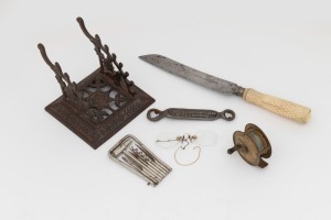 Antique multi-tool, whalebone bread knife, American cast iron quill stand, antique pince nez in case, BAXTER'S PATENT No. 1 button tool and a vintage fly fishing reel, 19th and 20th century, (6 items), ​​​​​​​the knife 31cm long