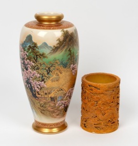A Japanese Satsuma baluster vase with hand-painted blossom and mountain landscape with&nbsp;gilt highlights, together with a Chinese porcelain brush pot with all over dragon decoration. Both with character marks to the bases. 20th century. The vase 31cm high.