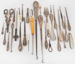 Assorted crochet hooks, boot hooks, shoehorn, pen knives, bread knife, grape scissors, letter opener, etc., mostly silver, 19th and 20th century, the largest 36cm high