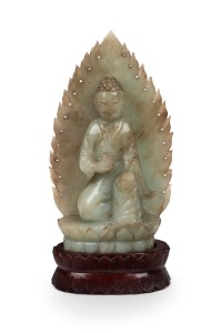 A Chinese carved jade Buddha statue on carved timber lotus base, 19th/20th century, 20.5cm high