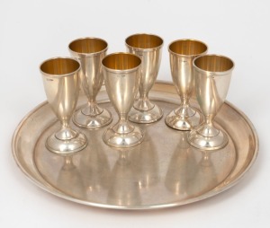 A set of six Russian silver vodka cups with tray, the cups of goblet form, marked "TФ8" and with post 1926 Kokoshnik mark 875, 20th century, (7 items), ​​​​​​​the cups 7.5cm high, 412 grams total