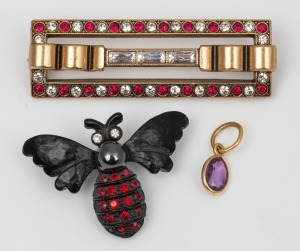 A 9ct gold bar brooch, set with red and white stones, together with an insect brooch, and a gold mounted amethyst charm, (3 items), the gold brooch 4.5cm wide, 8 grams total