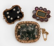 Three antique mourning brooches, gold and pinchbeck, 19th century, the largest 3.4cm wide