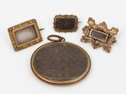 Four assorted antique mourning brooches, gold and gold plate, 19th century, ​​​​​​​the largest 3.5cm wide