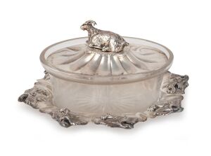 A Georgian sterling silver butter pot with Billy goat finial and original glass liner, made in Birmingham, circa 1834, 9cm high, 20cm wide, 342 grams silver weight