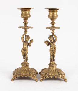 A pair of French cast brass candlesticks with figural stems, 19th/20th century, 19.5cm high