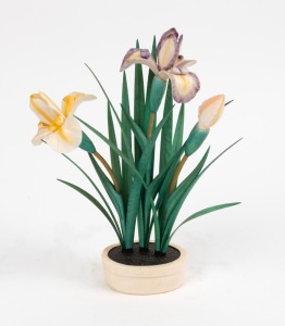 A Chinese carved ivory hand-painted floral display of potted iris, early to mid 20th century, 21cm high