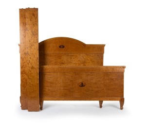 An Antique French Art Nouveau&nbsp;double bed, with arch top headboard veneered in satin birch with owl and putti inlay, early 20th century., (with original side rails). 134cm high, 192cm long, 159cm wide.