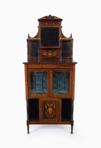 An antique English Sheraton Revival parlour display cabinet of small proportions. Rosewood veneered with fine marquetry inlay in the classical manner. Mirrored back with turned&nbsp;column shelf supports and decorative brass gallery. The lower cabinet with cen