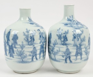 A pair of antique Japanese blue and white porcelain vases, Meiji period, 19th century, bearing remains of paper labels, ​​​​​​​22cm high