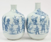 A pair of antique Japanese blue and white porcelain vases, Meiji period, 19th century, bearing remains of paper labels, ​​​​​​​22cm high
