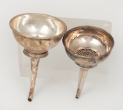 Two antique English Georgian sterling silver wine funnels, both London made, maker's mark rubbed on one with date letter for 1815. The other missing&nbsp;it's rest, marks rubbed, makers mark "A.L." (with star above initials) possibly&nbsp;Aug. Le Sage. the larger 1 - 2