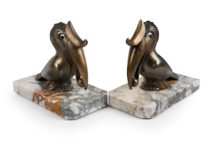A pair of French Art Deco cast metal toucan bookends on marble bases, circa 1925, 13cm high overall