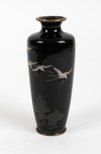 An antique Japanese cloisonne vase decorated with flying cranes on black ground, Meiji Period, 19th century, 14.5cm high