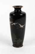 An antique Japanese cloisonne vase decorated with flying cranes on black ground, Meiji Period, 19th century, 14.5cm high