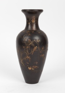 A fine quality Japanese bronze vase adorned with blossom tree and birds, highlighted in gold, copper and silver, Meiji Period, 19th/20th century, three character seal mark to base, 24cm high