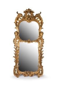An impressive antique English&nbsp;Rococo gilt wood pier mirror with boldly carved scroll frame, female masks and central crest adorned with carved fruit. Lime wood frame with original water gilt finish, 19th century, an imposing 248cm high, 118cm wide.