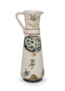 Reproduction sparrow beak jug with floral decoration and gilt highlights in the style of William Moorcroft for James Macintyre & Co.&nbsp; 25cm high.