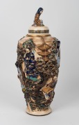 An antique Japanese lidded urn, intricately decorated with applied and raised scene of figures in landscape, Meiji Period, 19th/20th century, seal mark to base, 52cm high - 2