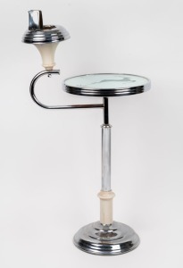An Art Deco&nbsp;style smokers stand with nickel plated pedestal and acid etched mirror table top. 20th century78cm high