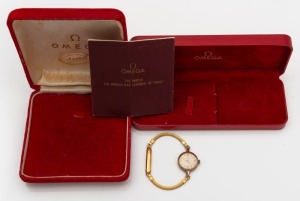 OMEGA lady's watch with manual wind movement in 9ct gold case, together with two OMEGA branded boxes, and an OMEGA booklet (for a quartz watch), (4 items).