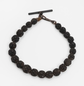 An antique Continental carved bog oak bead fob chain with Berlin iron&nbsp;fittings, 19th century, 20cm long.
