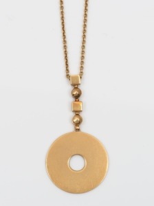 An 18ct gold circular pendant on chain, late 20th century, stamped "750", the chain 50cm long, 18.5 grams total.